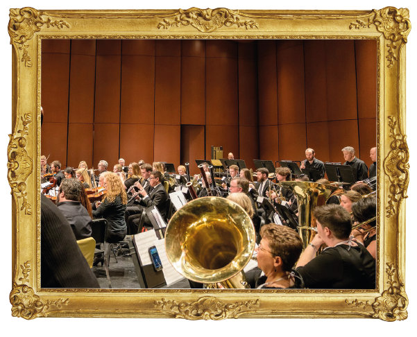 Orchestra playing in gold frame